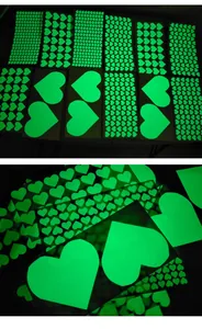 Glow-in-the-dark heart stickers for wall decoration with luminous green fluorescent effect