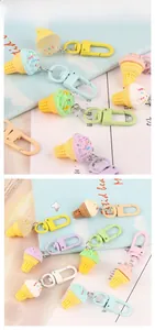 Macro detail of assorted pastel resin ice cream cone keychains with matte lobster clasps