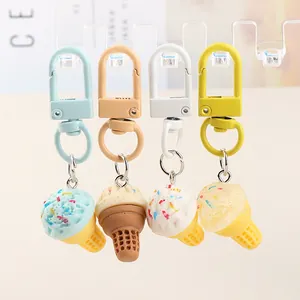 Set of four colorful resin ice cream cone keychains with metallic lobster clasps