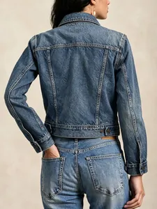 Retro blue denim jacket for women featuring classic back stitching and metal button details