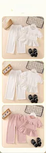 Detail of girls ruffled short sleeve top and wide leg pants set with vertical rib texture