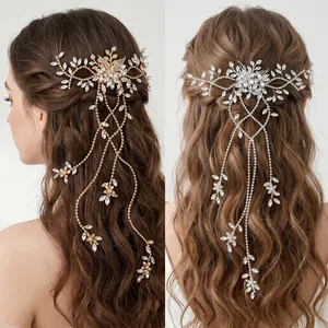 Detail of bridal floral headpieces with long rhinestone tassels in gold and silver