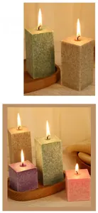 Macro shot of burning ice flower crystal textured candles with colorful pillar shapes
