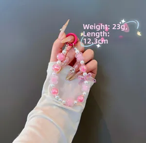 Pink beaded charm with bow and flower detail, length 12.3cm and weight 23g