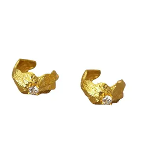 Irregular textured gold earrings with zircon stones and wrinkled bark pattern style
