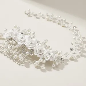 Elegant bridal hair comb with white resin roses, pearls, and sparkling crystals