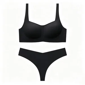 Flat lay of seamless black bra and thong set with high-stretch smooth fabric