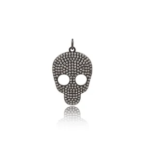 24K gold plated gothic skull pendant with white cubic zirconia stones and top hanging loop