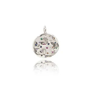 Round silver pendant with textured surface and colorful zircon stones on white background