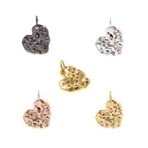 Detailed view of heart-shaped pendants with lava texture and colorful zircon stones
