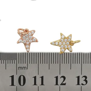 Pave zircon starfish charms in gold and rose gold plating with measurement scale