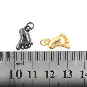 Gold and black baby footprint pendants with measuring ruler for DIY jewelry size reference