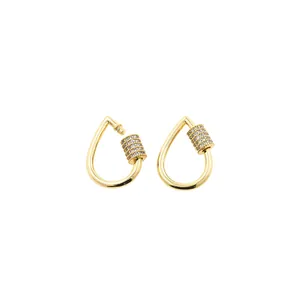 Close-up of gold-plated carabiner earrings with micro-pave zircon stone settings