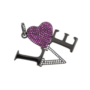 Detailed close-up of a 24K gold LOVE pendant with pink heart and zircon stones