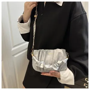 Silver pleated cloud bag with metallic chain and golden logo detail for women