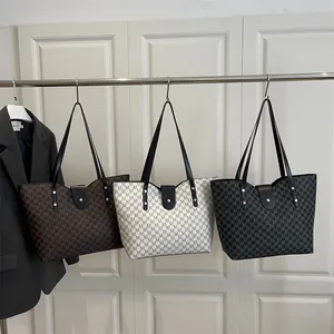 Three large monogram tote bags in brown, white and black for office commuting work wear