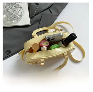 Detail shot showing the spacious interior capacity of this yellow patent leather bag