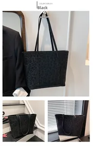 Detail shot of vintage black leopard print tote bag with premium suede texture