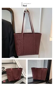 Detailed view of the dark red leopard pattern embossing on high-quality matte tote bag