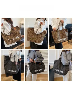 Detail view of large leopard print tote bag fabric with TOTE BAG text print