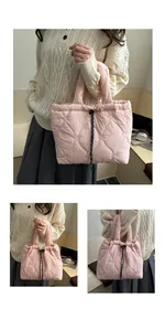 Detail of pink quilted tote bag with heart pattern and black drawstring buckle closure