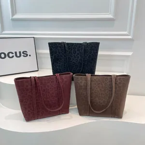 Three vintage leopard print tote bags in black, red, and brown for daily commute fashion