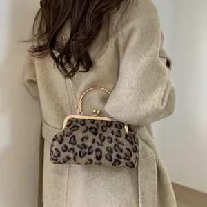 Elegant leopard print shell bag with golden metal handle and chain strap for women