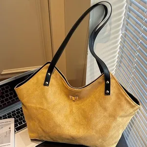 Large mustard yellow tote bag with quilted pattern and long straps for office commuting