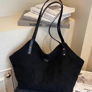Chic black large capacity tote bag in matte suede leather with decorative V-stitching