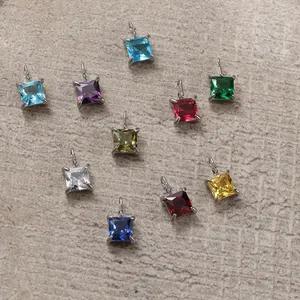 Square princess cut colorful gemstones in silver four-prong settings with detailed view