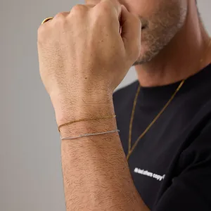 Minimalist gold and silver cubb chain bracelet set for women worn on wrist for daily style
