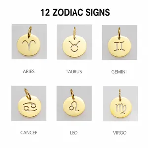 Macro detail of six hollow gold-plated stainless steel zodiac charms for DIY jewelry
