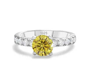 Detail of S925 silver ring featuring a yellow round-cut stone and four-prong setting