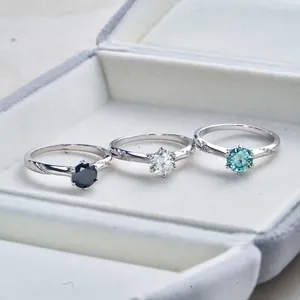 Detailed close-up of S925 sterling silver rings with colorful moissanite stones