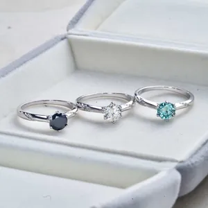 Three S925 silver moissanite rings with six-prong settings in black, white, and blue gems