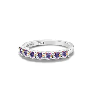 Macro detail of S925 sterling silver stamp and seven rainbow moissanite stones on ring