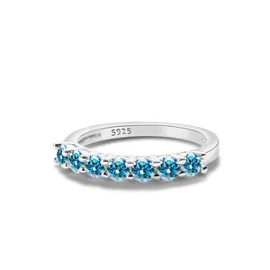 Close-up of S925 sterling silver ring with seven round blue moissanite stones