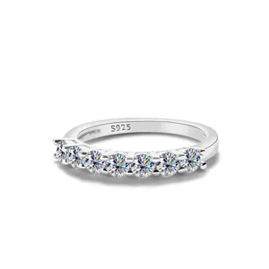 Macro shot of 925 sterling silver ring showing S925 hallmark and seven round stones