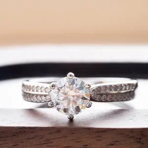 Detailed macro shot of a six-prong moissanite engagement ring with side diamonds