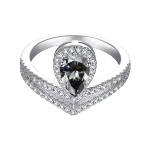 Detailed view of pear-cut grey stone and V-shaped pave band on sterling silver ring
