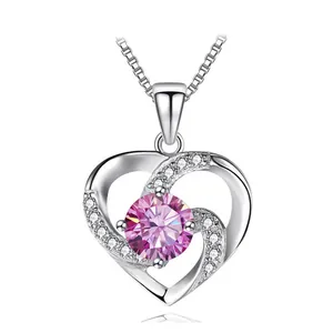Detail of s925 silver heart necklace featuring a pink gemstone and delicate box chain