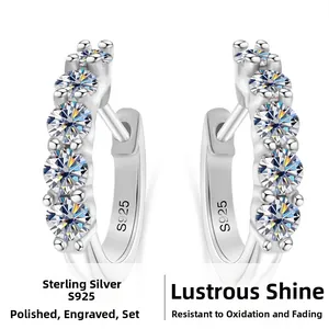 Macro shot of S925 sterling silver hoop earrings with five sparkling moissanite stones