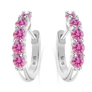 Detail of silver S925 sterling silver hoop earrings with five pink zircon stones