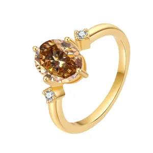 Detailed side view of 18K gold ring with oval champagne moissanite and side stones