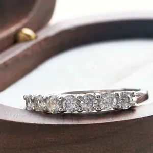 Detailed close-up of a 925 silver half-eternity ring with seven brilliant round-cut stones