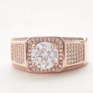Macro shot of rose gold wide band ring with a large round moissanite and pavé set diamonds