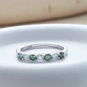 S925 sterling silver ring featuring green and white moissanite stones in a prong setting