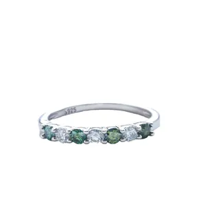 Elegant S925 silver ring featuring seven round-cut green and white moissanite stones