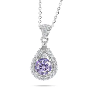 Macro shot of 925 silver necklace featuring a pear-shaped pendant with a purple moissanite