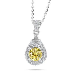 Macro shot of 925 sterling silver water drop pendant with a round yellow moissanite